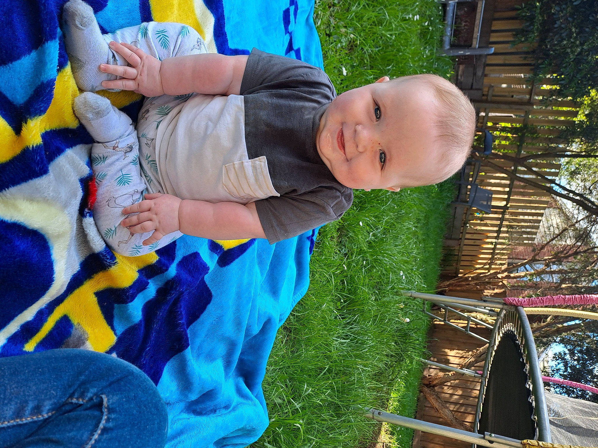 Jake is registered to the contest to win money with this photo: baby, baby_products, baby_toddler_clothing, blue, child, electric_blue, event, fun, grass, happy, joy, leisure, people, people_in_nature, person, plant, play, recreation, sitting, smile