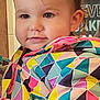 Lilly joined the competition — help win amazing prizes! toddler, child, face, smile, jacket, colorful_clothing, geometric_pattern, indoor, portrait, cute, young_child, cheeks, hair, eyes, person, apparel, warm_clothing, closeup, expression, background