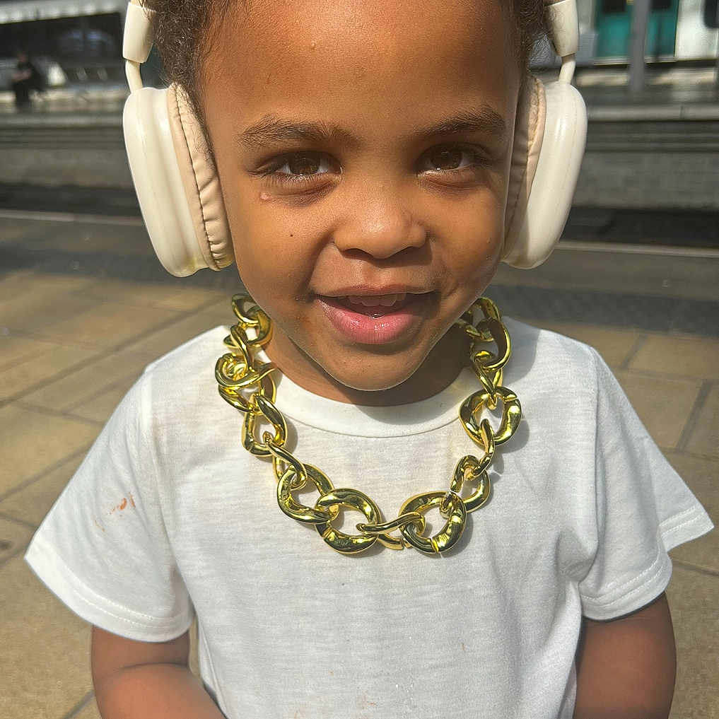 Quinn joined the competition — help win amazing prizes! accessories, bodypart, bracelet, child, clothing, electronics, face, female, finger, girl, hand, happy, head, headphones, jewelry, necklace, person, photography, portrait, smile