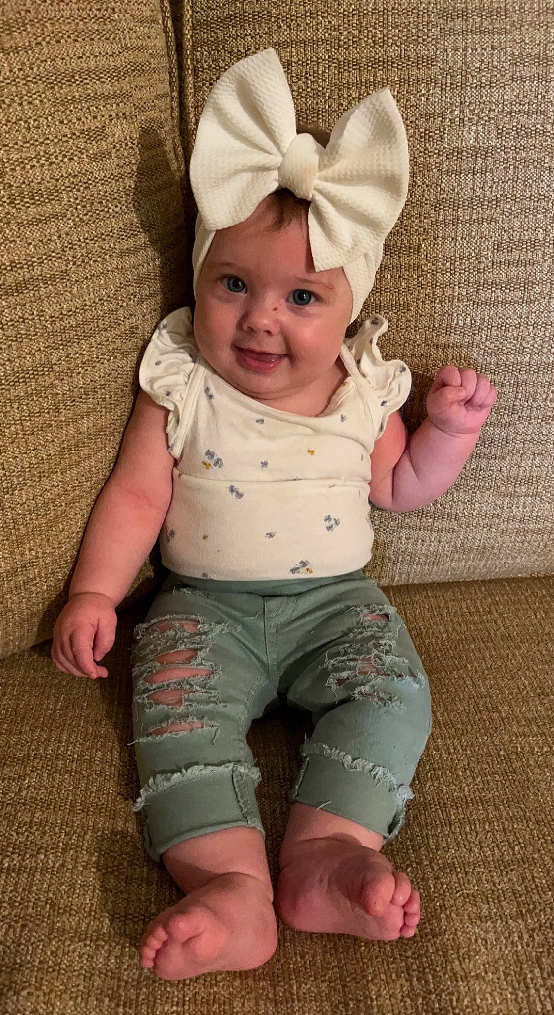 Oakley is registered to the contest to win money with this photo: baby, baby_toddler_clothing, cap, cheek, costume_hat, eye, face, facial_expression, finger, happy, head, headband, human_body, joy, leg, person, pink, skin, sleeve, smile