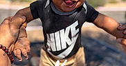 Zyir joined the competition — help win amazing prizes! toddler, child, smiling, happy, outdoor, nike, black_shirt, shorts, holding_hands, person, footwear, sunlight, portrait, cute, curly_hair, expression, playful, daylight, skin, young