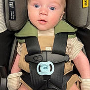 Ryker joined the competition — help win amazing prizes! baby, blue_eyes, car_seat, child, closeup, clothing, curious, cute, face, harness, head_support, indoor, infant, mittens, pacifier, person, safety, seatbelt, striped, young