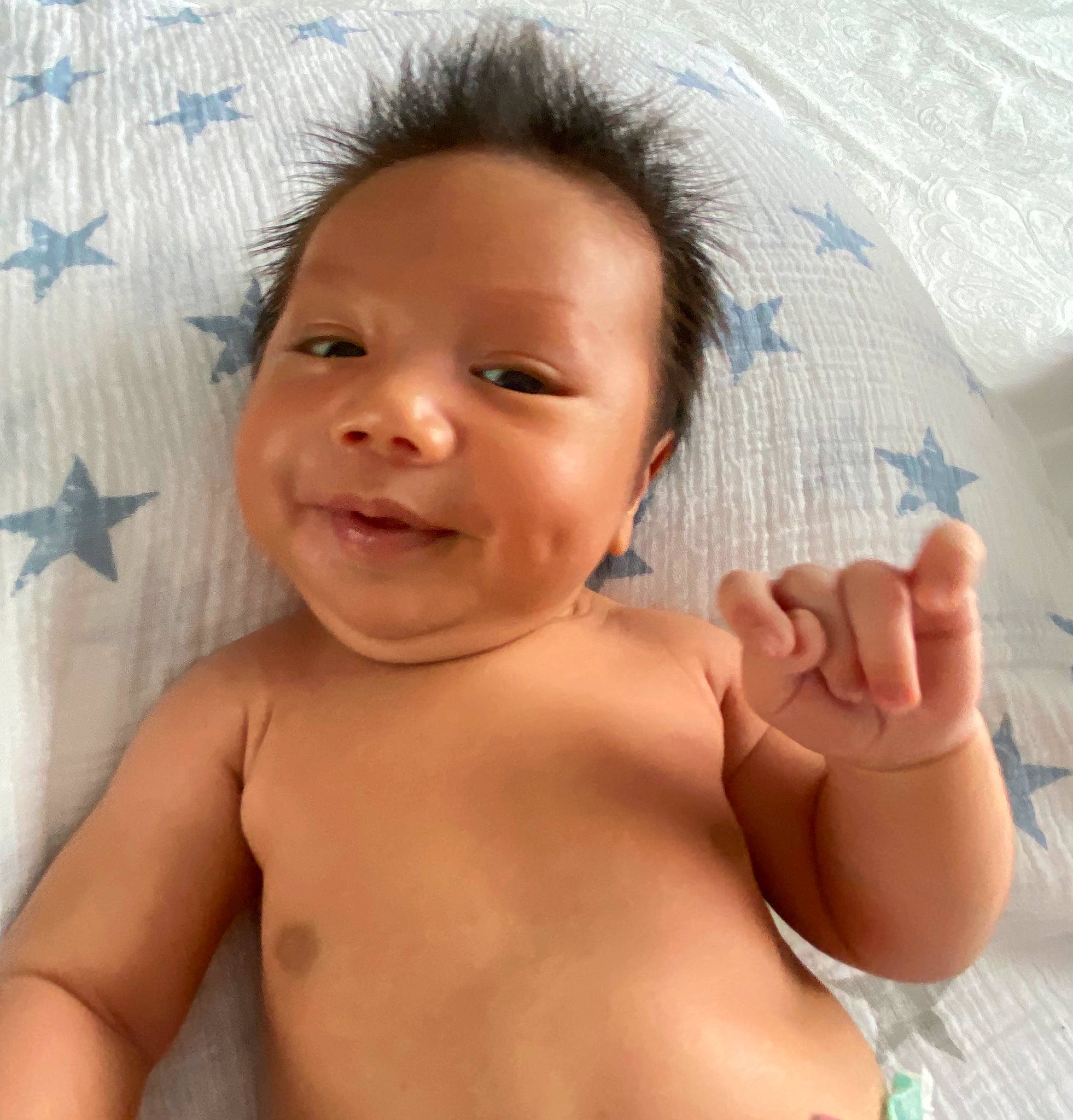 Matias is registered to the contest to win money with this photo: arm, baby, baby_bathing, baby_making_funny_faces, cheek, child, face, finger, gesture, hand, head, lip, mouth, muscle, neck, nose, person, skin, smile, thumb