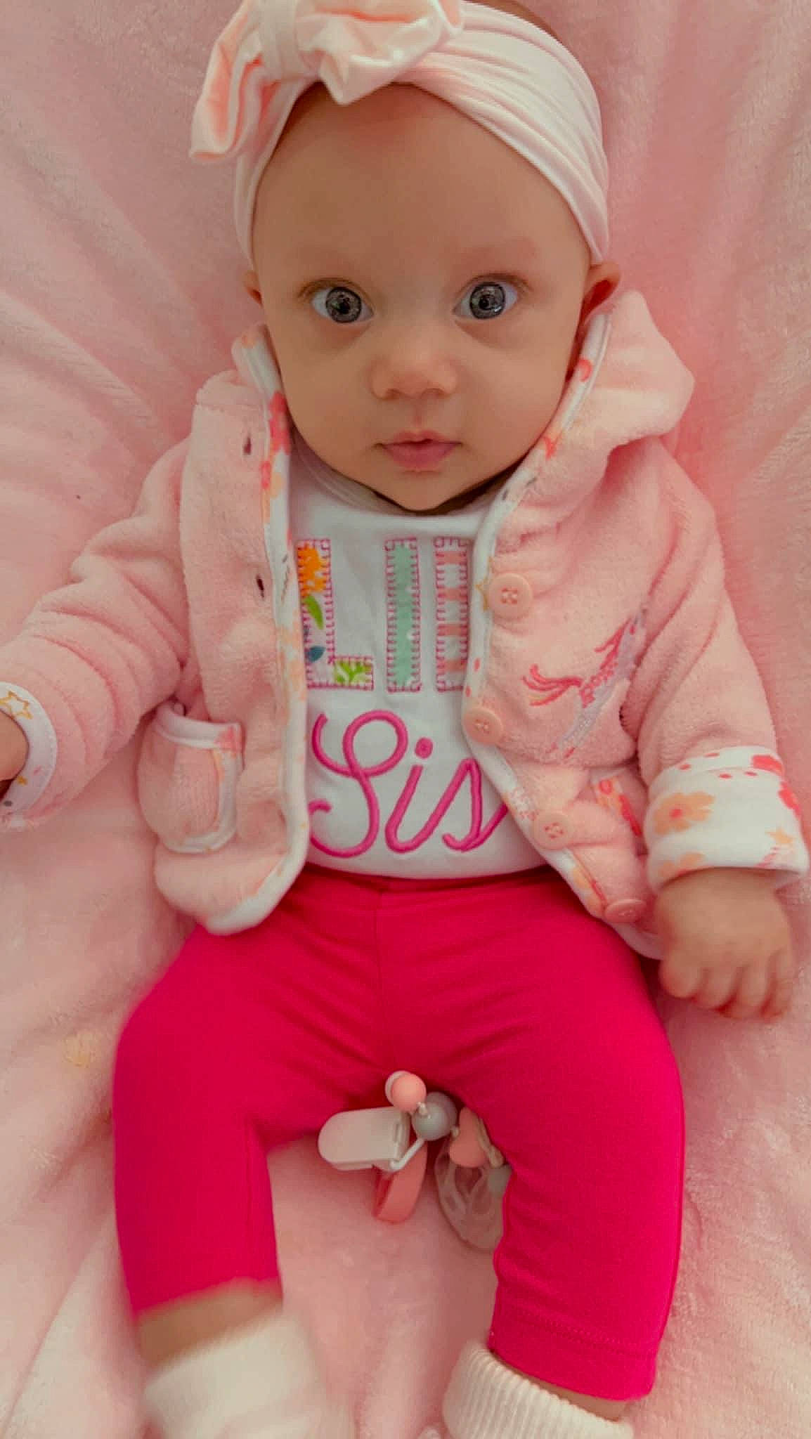 Lakelyn joined the competition — help win amazing prizes! arm, baby, baby_toddler_clothing, cap, cheek, eye, face, finger, gesture, hand, happy, head, headwear, human_body, lip, person, pink, skin, sleeve, t_shirt