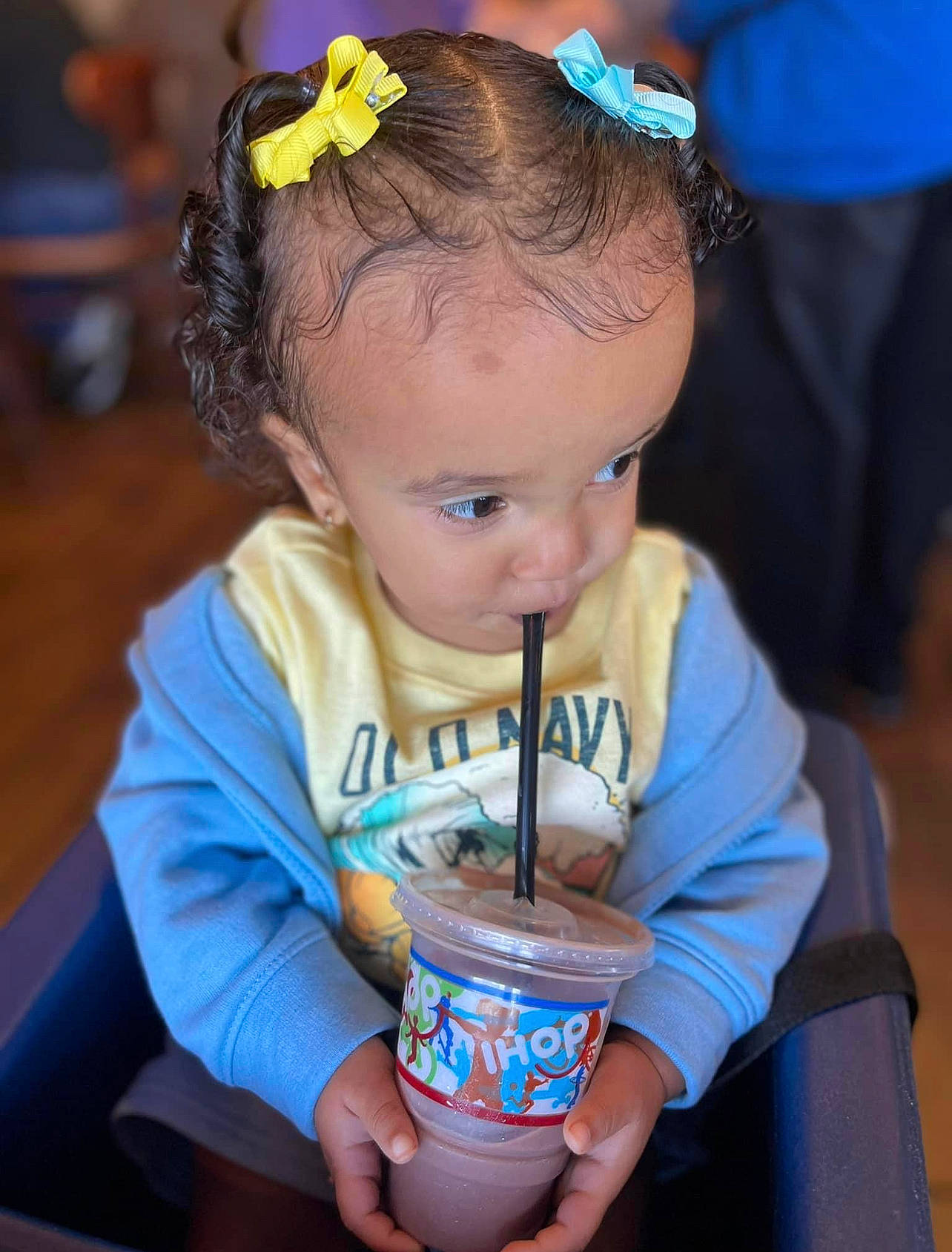 Leighton is registered to the contest to win money with this photo: blue, child, cup, drink, drinking, drinkware, electric_blue, event, eye, facial_expression, fun, hair_accessory, happy, hat, headband, human, organ, person, skin, snapshot