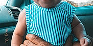 Nova is registered to the contest to win money with this photo: ankle, baby, babylaughing, bodypart, clothing, dress, face, finger, hand, happy, head, laughing, newborn, person, photography, portrait, sitting, smile