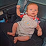 Nova is registered to the contest to win money with this photo: baby, bodypart, car, chair, clothing, couch, cushion, doll, face, finger, furniture, hand, head, homedecor, pants, person, photography, toy, transportation, vehicle
