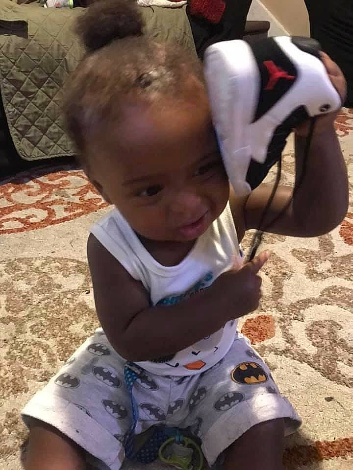 Quadir is registered to the contest to win money with this photo: arm, baby, child, cool, ear, head, leg, person, play, smile, toddler