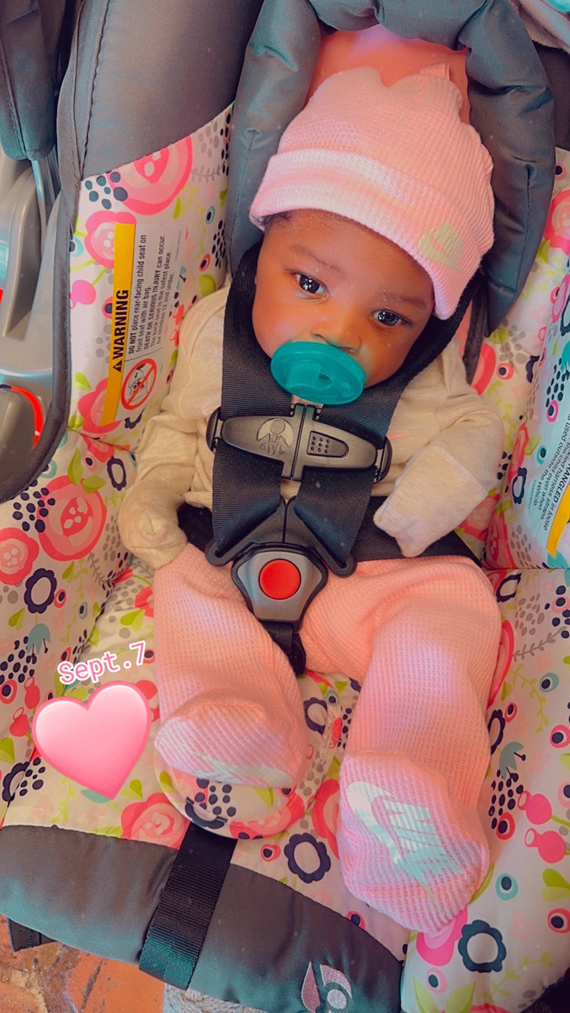 Taylor is registered to the contest to win money with this photo: baby, baby_carriage, baby_in_car_seat, baby_products, baby_safety, baby_sleeping, baby_toddler_clothing, cap, car_seat, cheek, child, comfort, headwear, lap, linens, pattern, person, personal_protective_equipment, pink, sitting