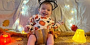 Raphaël participe au concours pour gagner de l'argent avec cette photo : autumn_leaves, baby, blanket, child, costume, cute, decorations, festive, glowing_lights, halloween, happy, headband, holiday, indoors, orange, pumpkin, skeleton, smiling, spider_web, yellow