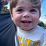 Myles Greco joined the competition — help win amazing prizes! toddler, child, smiling, closeup, outdoor, daylight, stroller, hand, face, happy, person, short_hair, blue_sky, cloud, clothing, casual, greenery, holding, baby, portrait