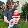 Easton is registered to the contest to win money with this photo: baby, child, woman, outdoor, grass, house, garden, tree, flower, person, holding, clothing, shorts, shirt, socks, greenery, daylight, portrait, yard, smile