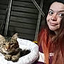 Lil Tracy joined the competition — help win amazing prizes! cat, tabby_cat, pet, person, woman, selfie, long_hair, ombre_hair, pet_bed, cozy, indoor, metal_stairs, portrait, whiskers, relaxed, cute, face, smile, striped_fur, home