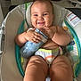 Brynlee is registered to the contest to win money with this photo: baby, infant, smiling, bottle, baby_seat, chubby, happy, indoor, cushion, cute, child, person, skin, legs, hand, face, expression, toy, comfort, seat
