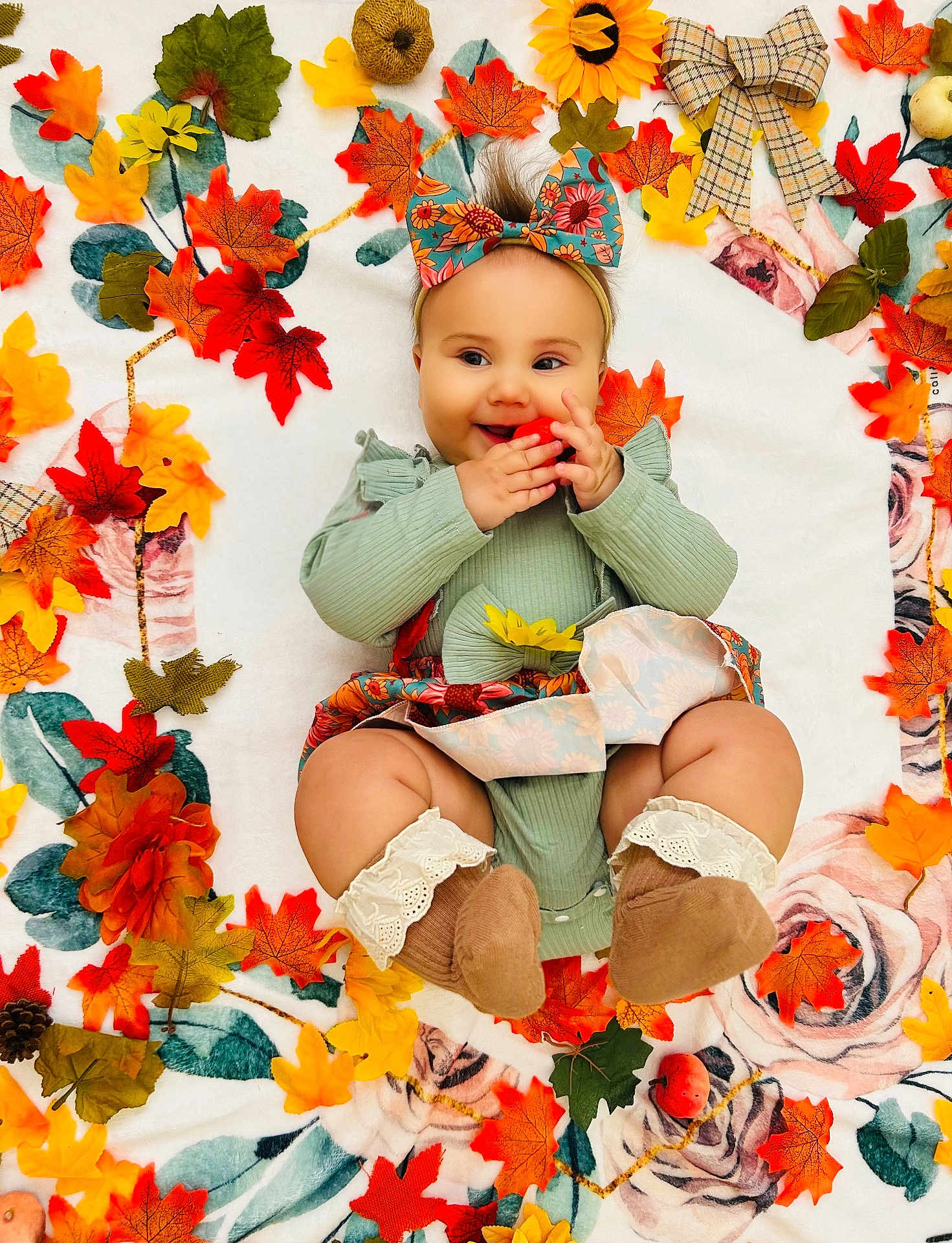 Brynlee joined the competition — help win amazing prizes! baby, infant, child, autumn, fall, leaves, floral_bow, smiling, cute, blanket, colorful, orange, yellow, green, red, socks, dress, indoors, portrait, happy