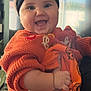 baby, child, smile, happy, headband, black, orange, pumpkin, pants, sweater, clothing, cute, indoor, person, holding, hand, face, young, festive, holiday
