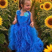 Miracle is registered to the contest to win money with this photo: child, girl, blue_dress, sunflower, field, flowers, nature, outdoor, sunset, smile, happy, portrait, flower_bed, sunlight, greenery, dress, ruffles, young, cute, scenic