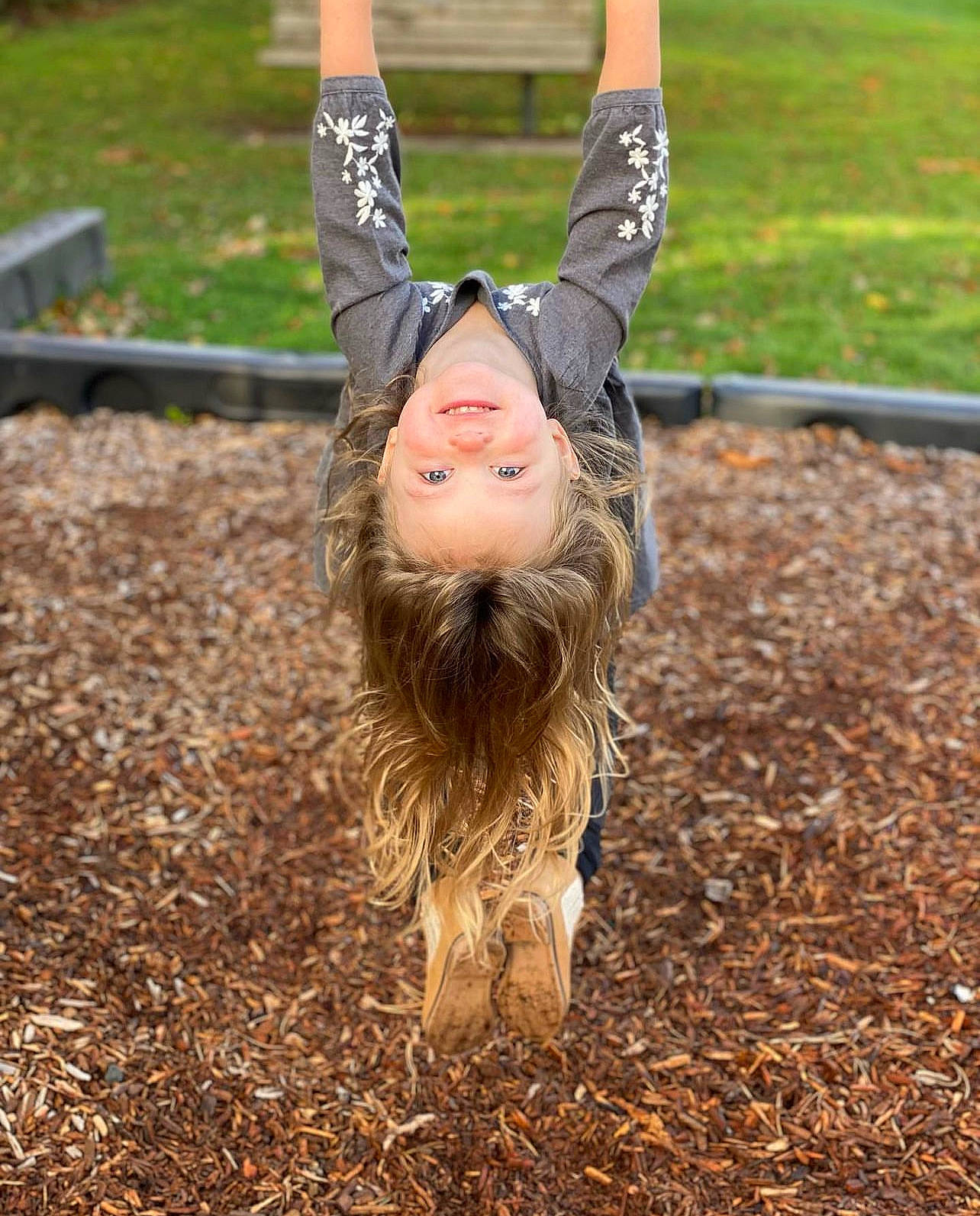 Adelyn is registered to the contest to win money with this photo: eye, fun, grass, hair, happy, human_body, human_leg, joy, leisure, long_hair, outdoor_play_equipment, people_in_nature, person, physical_fitness, plant, recreation, sitting, smile, soil, sportswear