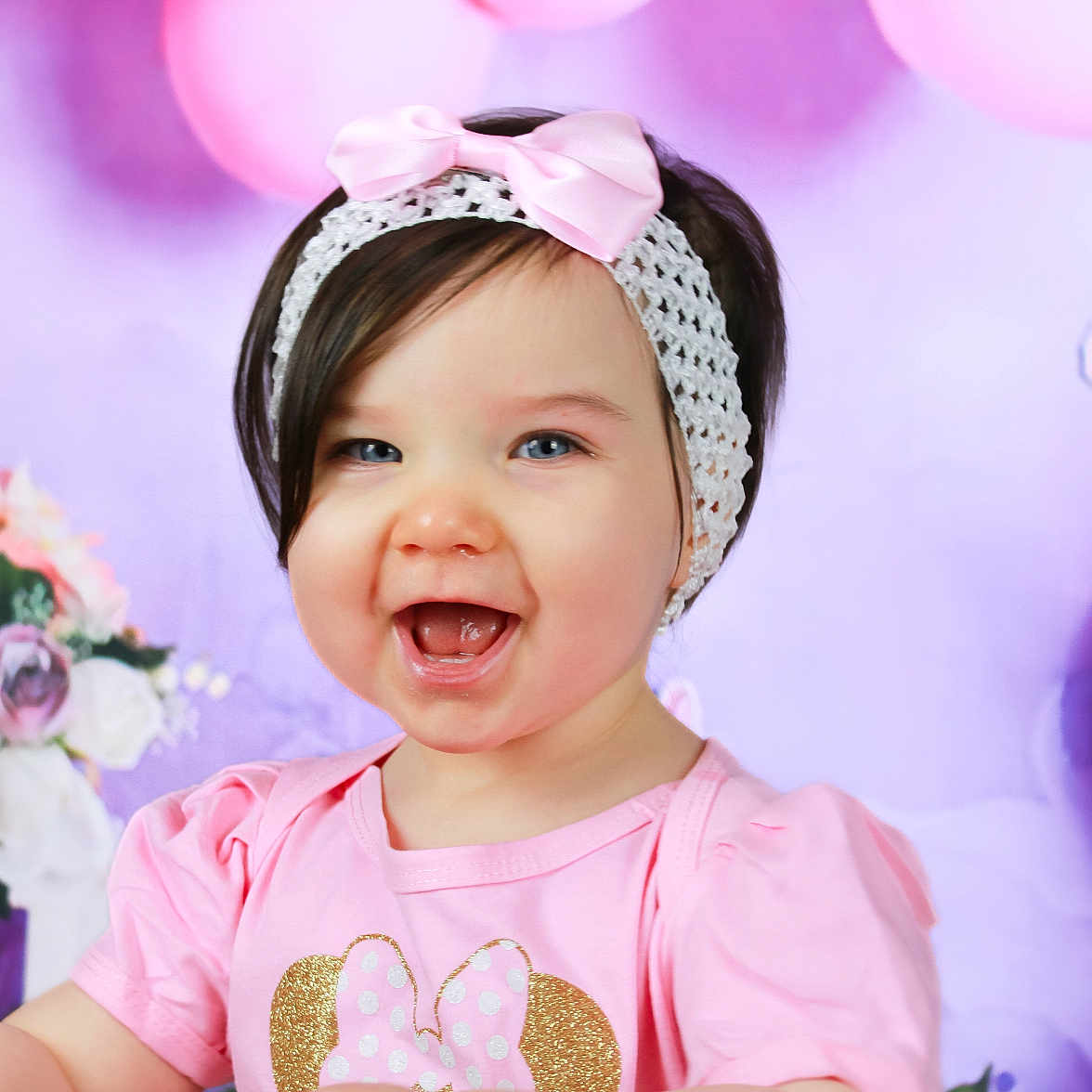 Scarlett is registered to the contest to win money with this photo: accessories, baby, babylaughing, balloon, clothing, face, flower, flowerarrangement, flowerbouquet, happy, hat, head, laughing, person, photography, plant, portrait, purple, rose, smile