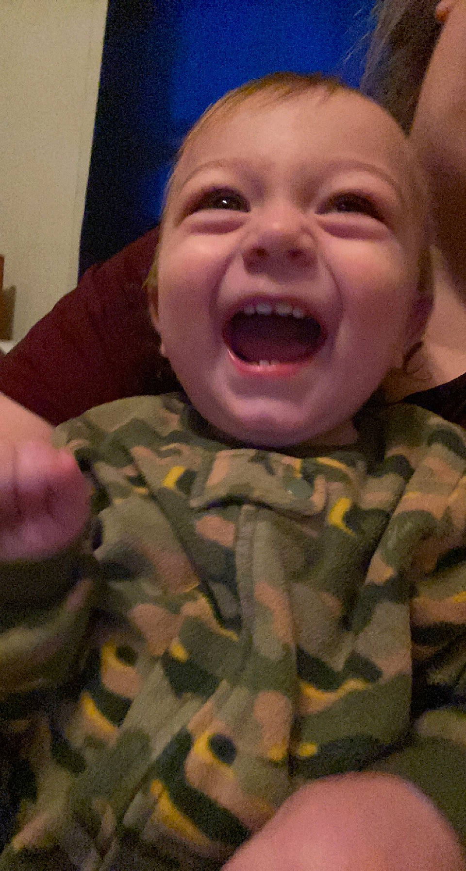 Drayden is registered to the contest to win money with this photo: cheek, chin, eye, eyebrow, face, forehead, gesture, head, human_body, iris, lip, military_camouflage, mouth, nose, organ, person, skin, sleeve, smile, tongue