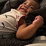 Zaylen joined the competition — help win amazing prizes! arm, baby, blanket, child, clothing, cozy, cute, face, happy, indoor, infant, light, lying_down, person, portrait, puma_logo, relaxed, sleeveless, smiling, soft_texture