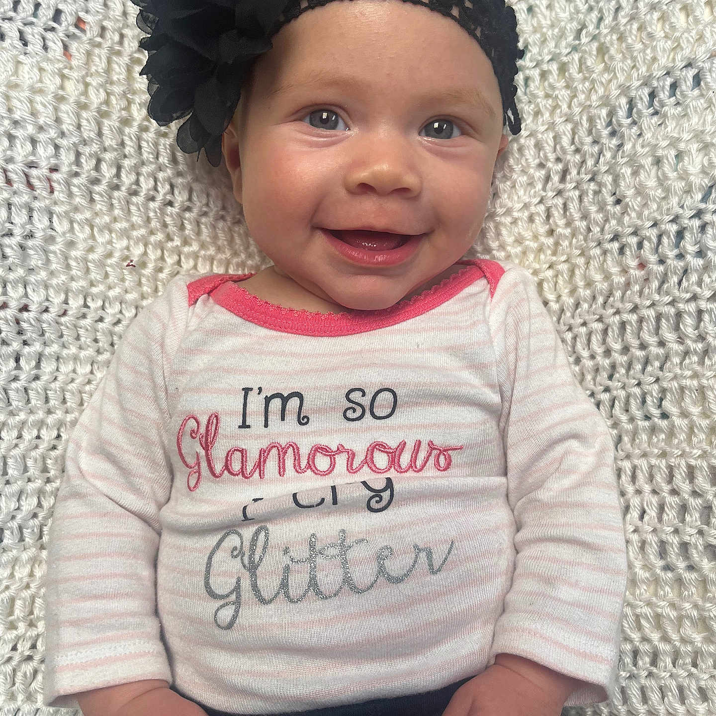 Riley is registered to the contest to win money with this photo: accessories, baby, bonnet, cap, clothing, face, happy, hat, head, homedecor, jewelry, knitwear, necklace, pants, person, photography, portrait, smile, sweater, t_shirt