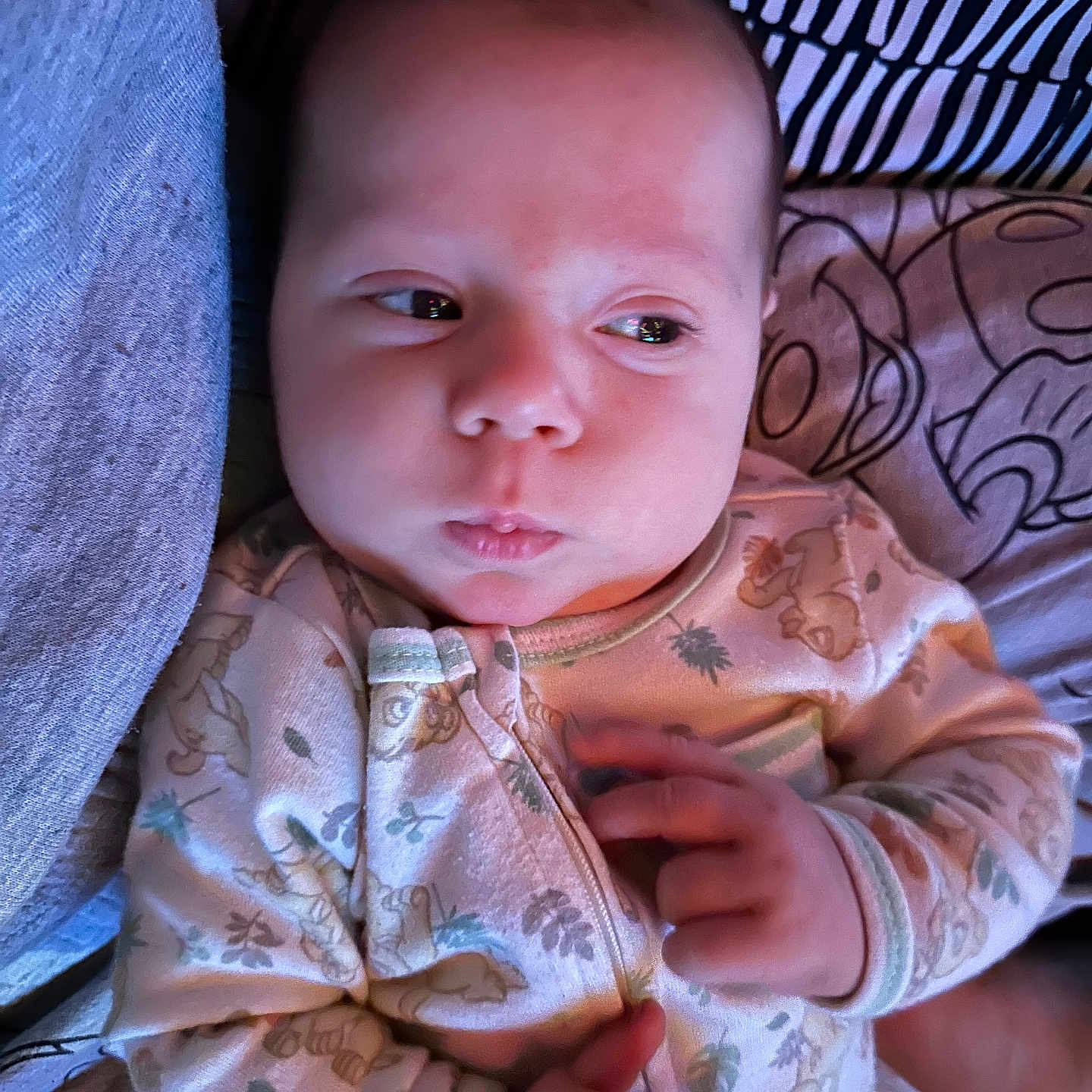 Adrastos joined the competition — help win amazing prizes! baby, bed, blanket, child, cozy, cute, expression, face, hands, indoors, infant, newborn, pajamas, plush, portrait, resting, sleepwear, soft_lighting, striped_pillow, young