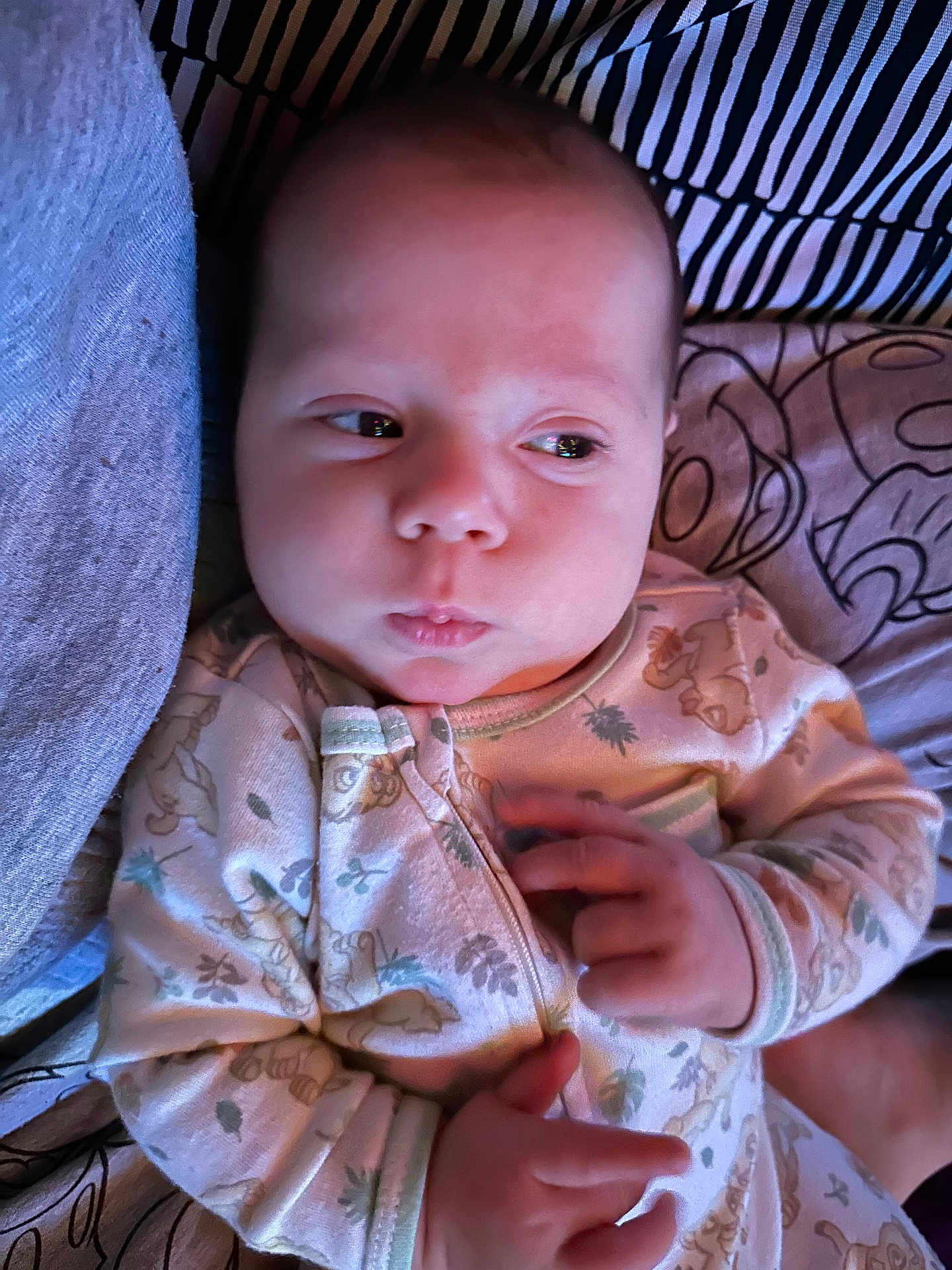 Adrastos joined the competition — help win amazing prizes! baby, bed, blanket, child, cozy, cute, expression, face, hands, indoors, infant, newborn, pajamas, plush, portrait, resting, sleepwear, soft_lighting, striped_pillow, young