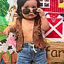 child, boy, sunglasses, vest, denim_shorts, cowboy_boots, cowboy, farm_backdrop, barn, cow, greenery, chain_necklace, posing, indoor, cute, serious_expression, short_hair, toy_theme, playful, colorful