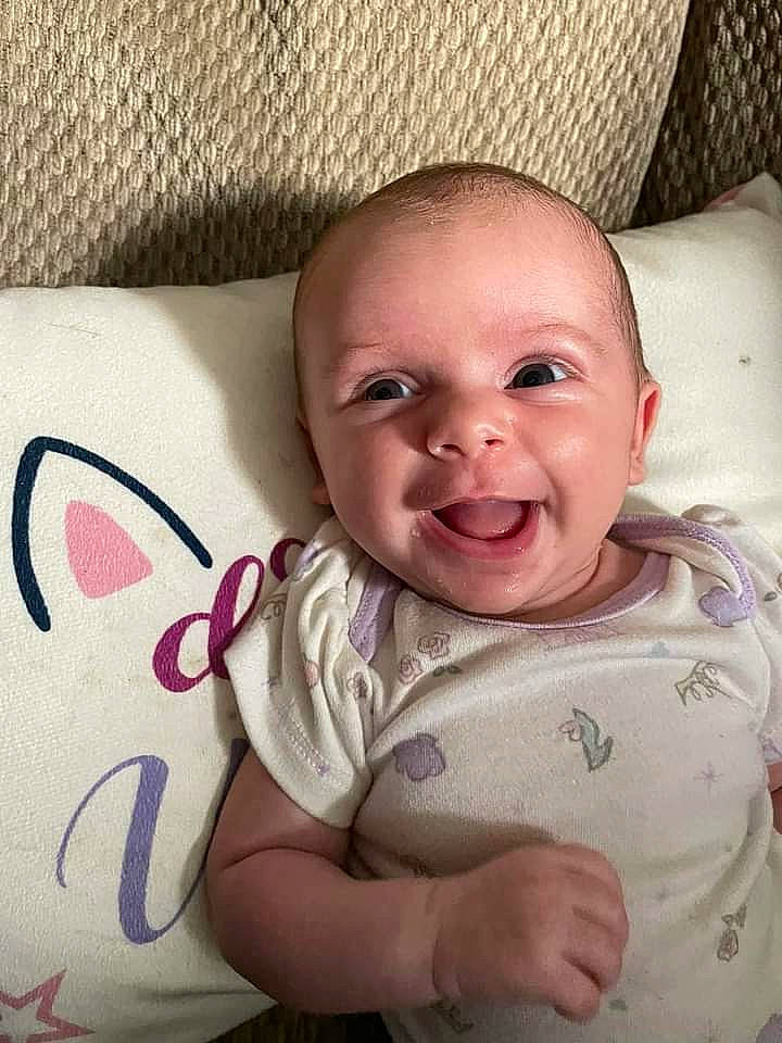 Sophia is registered to the contest to win money with this photo: baby, baby_toddler_clothing, cheek, chin, comfort, eye, eyebrow, face, facial_expression, gesture, happy, head, lip, mouth, neck, nose, person, skin, sleeve, smile