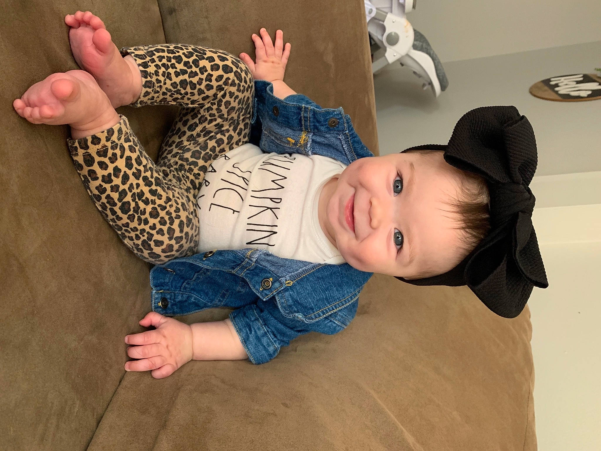 Annaleigha is registered to the contest to win money with this photo: baby, baby_toddler_clothing, child, comfort, fashion_accessory, flooring, foot, fun, hand, happy, hat, human_leg, joy, pattern, person, sitting, skin, sleeve, smile, thigh