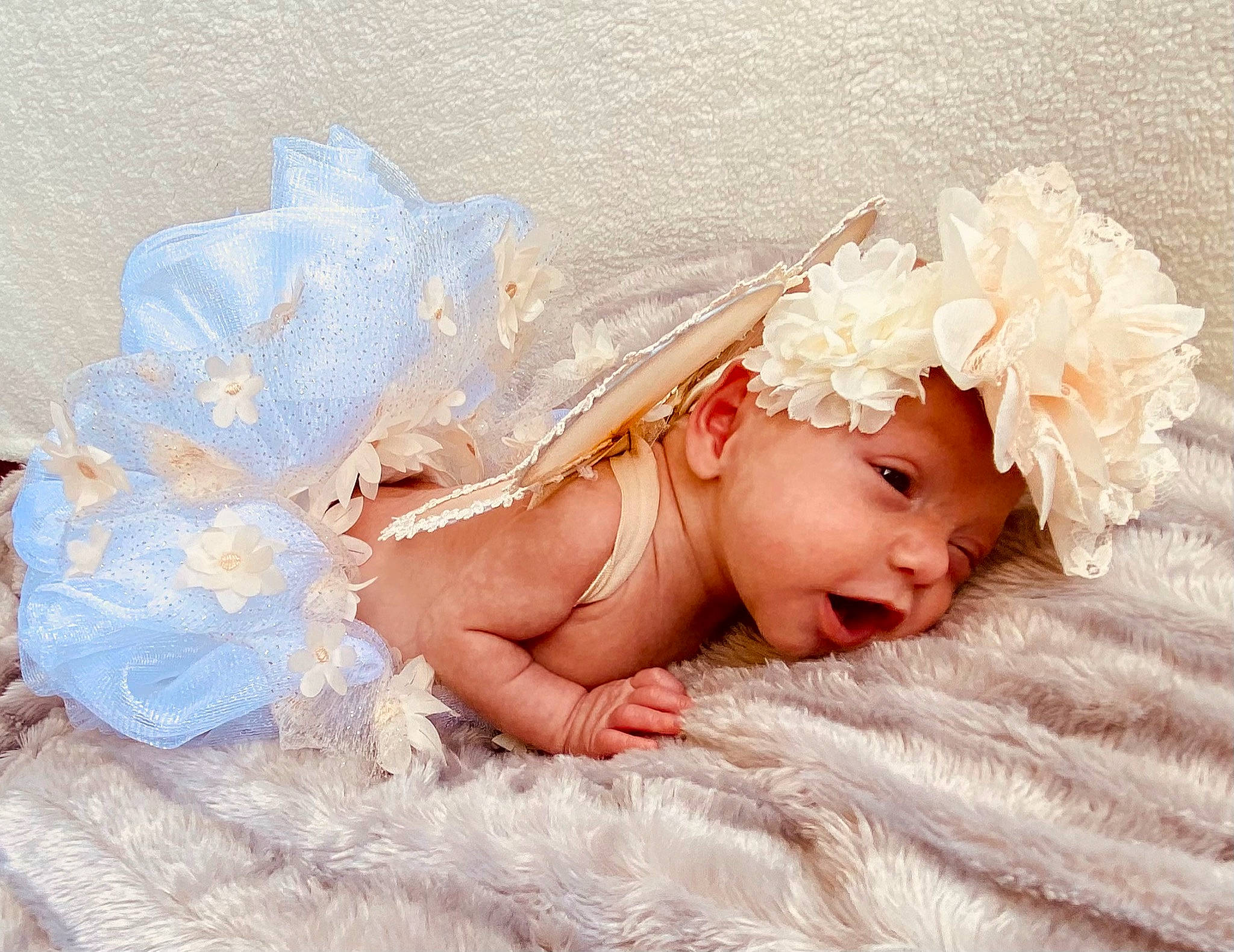 Maybelle is registered to the contest to win money with this photo: baby, baby_toddler_clothing, bridal_accessory, child, comfort, embellishment, fashion_accessory, flooring, hair_accessory, happy, headband, headgear, headpiece, headwear, iris, linens, mythical_creature, person, petal, pink