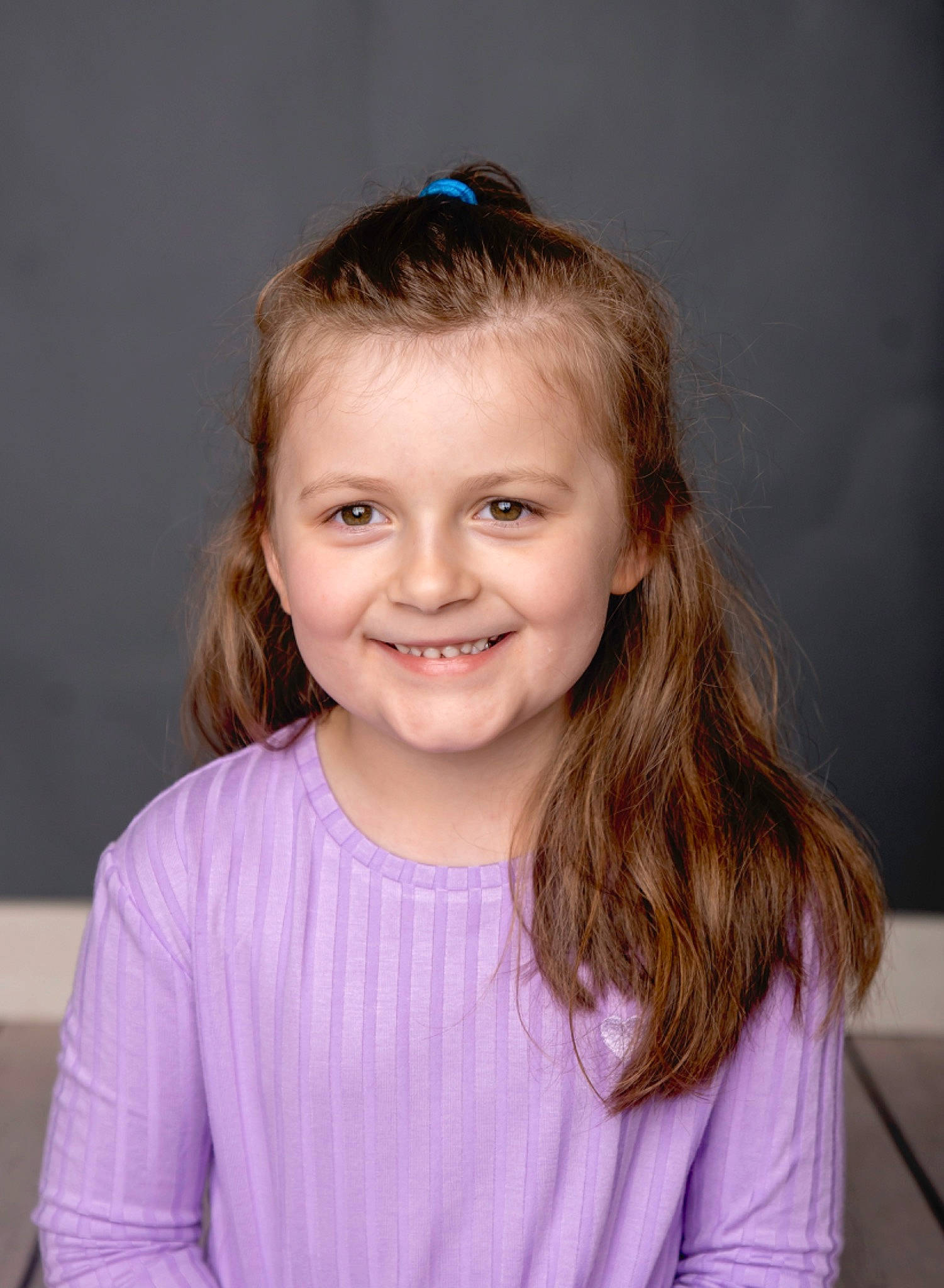 Lillian is registered to the contest to win money with this photo: blond, brown_hair, cheek, child, chin, electric_blue, eyebrow, eyelash, facial_expression, flash_photography, fun, hair, happy, iris, joy, long_hair, person, purple, skin, sleeve