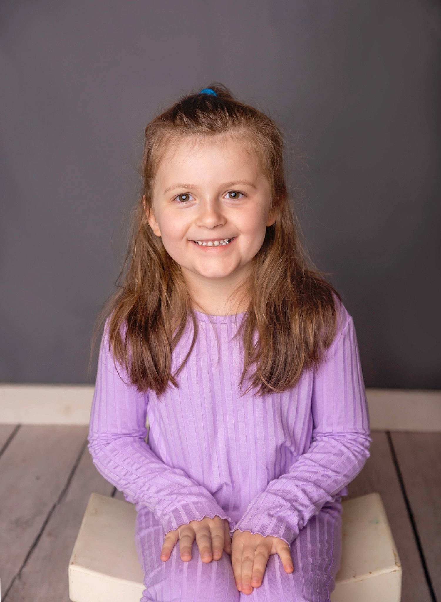 Lillian is registered to the contest to win money with this photo: baby_toddler_clothing, blond, cheek, child, comfort, face, facial_expression, flash_photography, fun, happy, human_body, iris, joy, magenta, person, purple, room, sitting, skin, sleeve