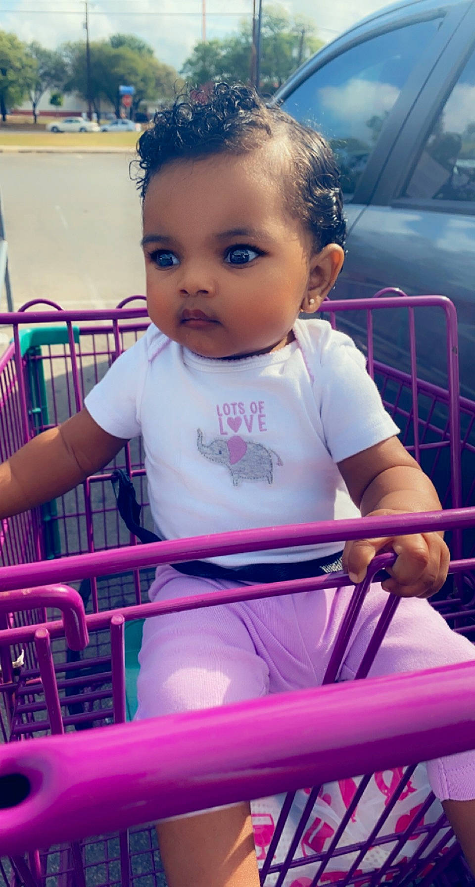 Justyce is registered to the contest to win money with this photo: baby, baby_toddler_clothing, chair, child, electric_blue, facial_expression, fun, grass, happy, leisure, magenta, person, pink, purple, recreation, shopping_cart, sitting, skin, t_shirt, toddler