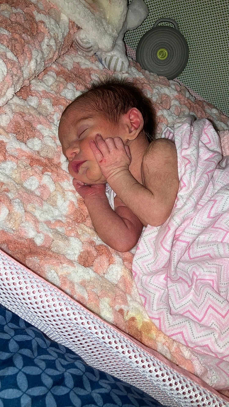Zahara joined the competition — help win amazing prizes! newborn, baby, sleeping, blanket, swaddle, infant, cozy, soft, delicate, cute, peaceful, resting, portrait, indoors, child, toddler, hand, face, pink, white