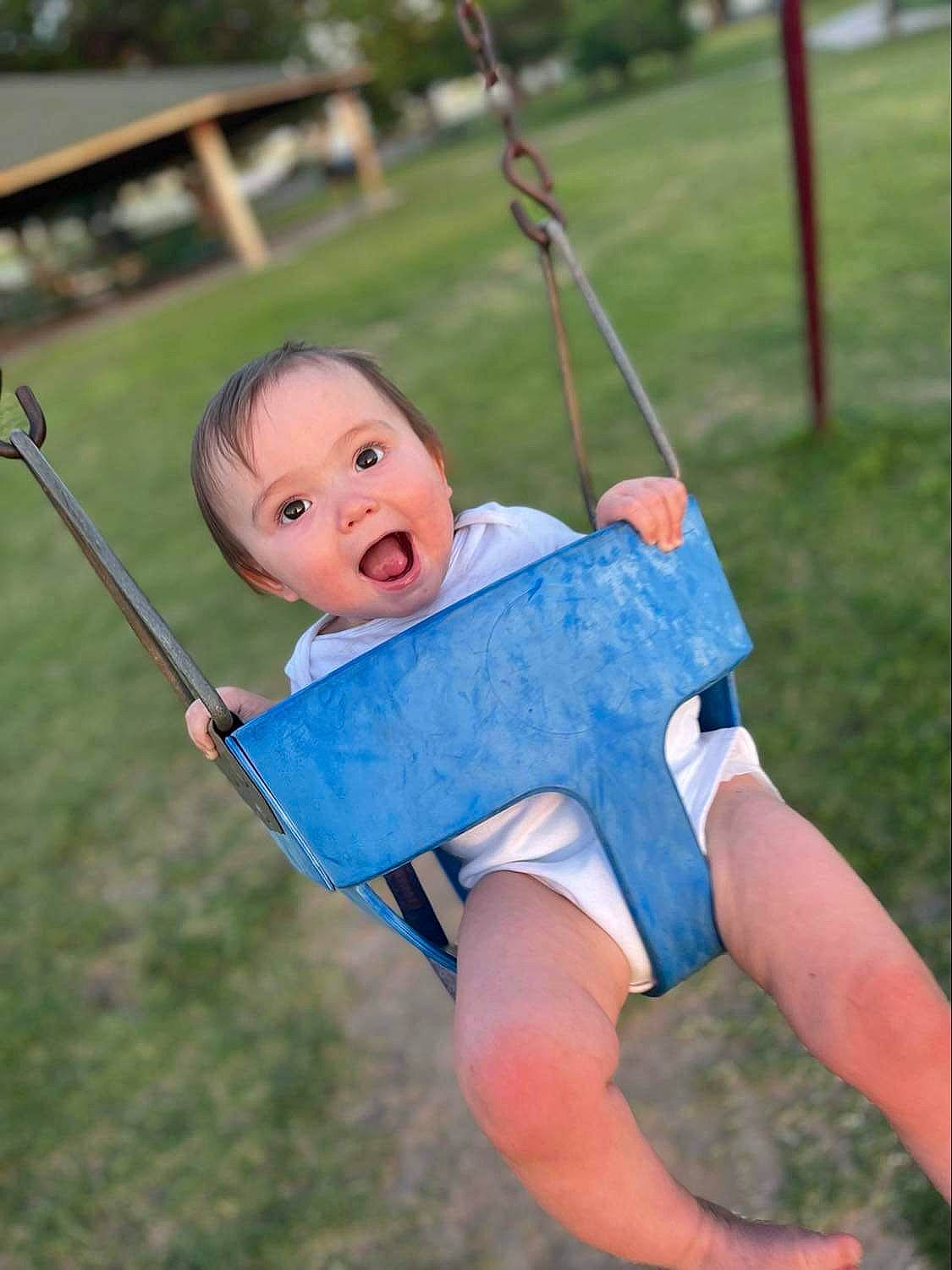 Kynlee joined the competition — help win amazing prizes! baby, child, city, electric_blue, fun, grass, hand, happy, leisure, mammal, outdoor_play_equipment, outdoor_recreation, person, plant, playground, recreation, rope, surprise, swing, toddler