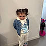 Jannah a rejoint le concours — aidez-le/la à gagner de superbes lots ! child, girl, pigtails, denim_jacket, hoodie, sweatpants, sneakers, indoor, floor, wall, smile, playful, toy, scooter, stitch_character, clothing, standing, cute, person, portrait