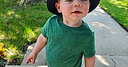 Elliot joined the competition — help win amazing prizes! toddler, child, hat, green_shirt, plaid_shorts, shoes, outdoor, sidewalk, tree, grass, sunlight, daytime, curious, portrait, person, young_child, casual_clothing, nature, summer, background