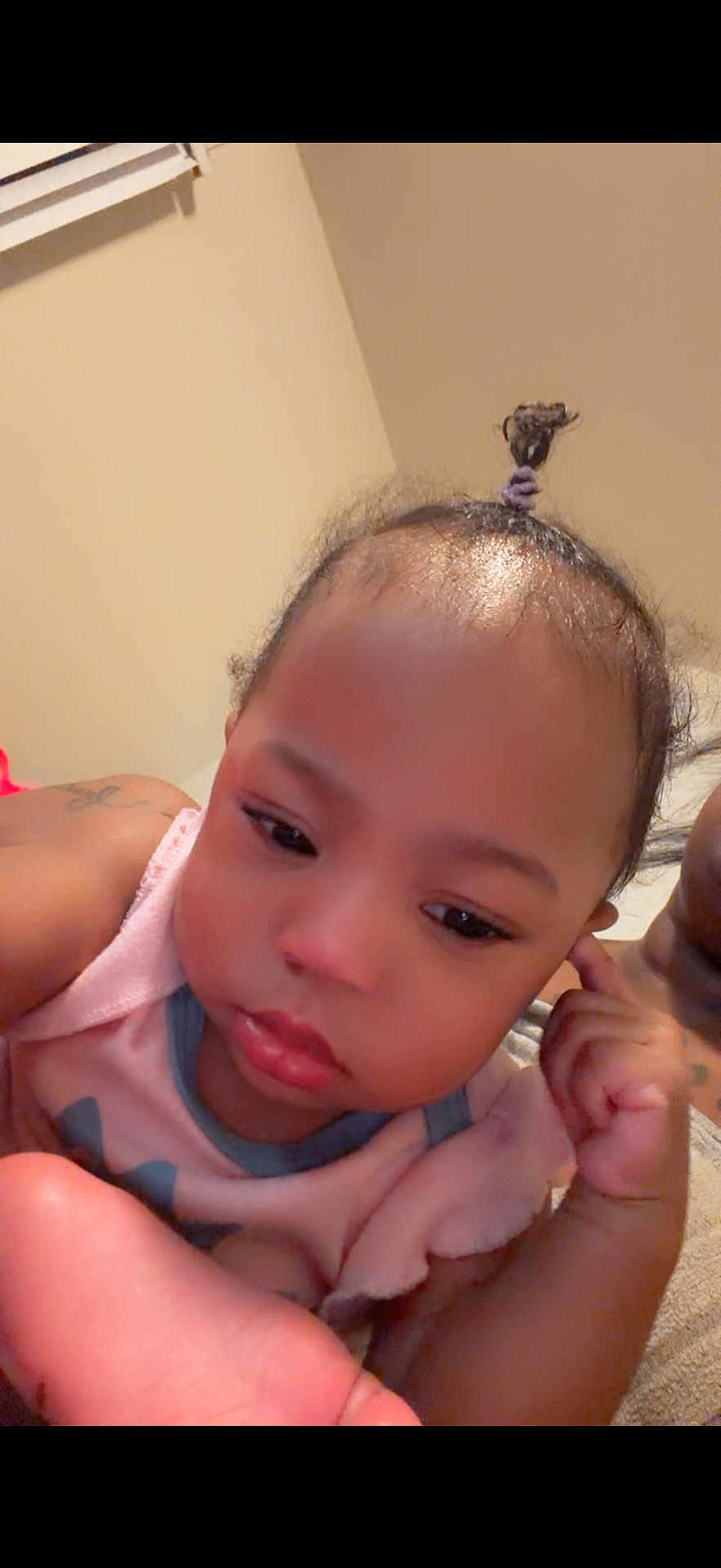 Kloie joined the competition — help win amazing prizes! baby, infant, child, face, portrait, closeup, indoor, bedroom, blanket, pajamas, topknot, hair_tie, hand, eyes, lips, skin, sleepy, parental_arm, tattoo, soft_lighting