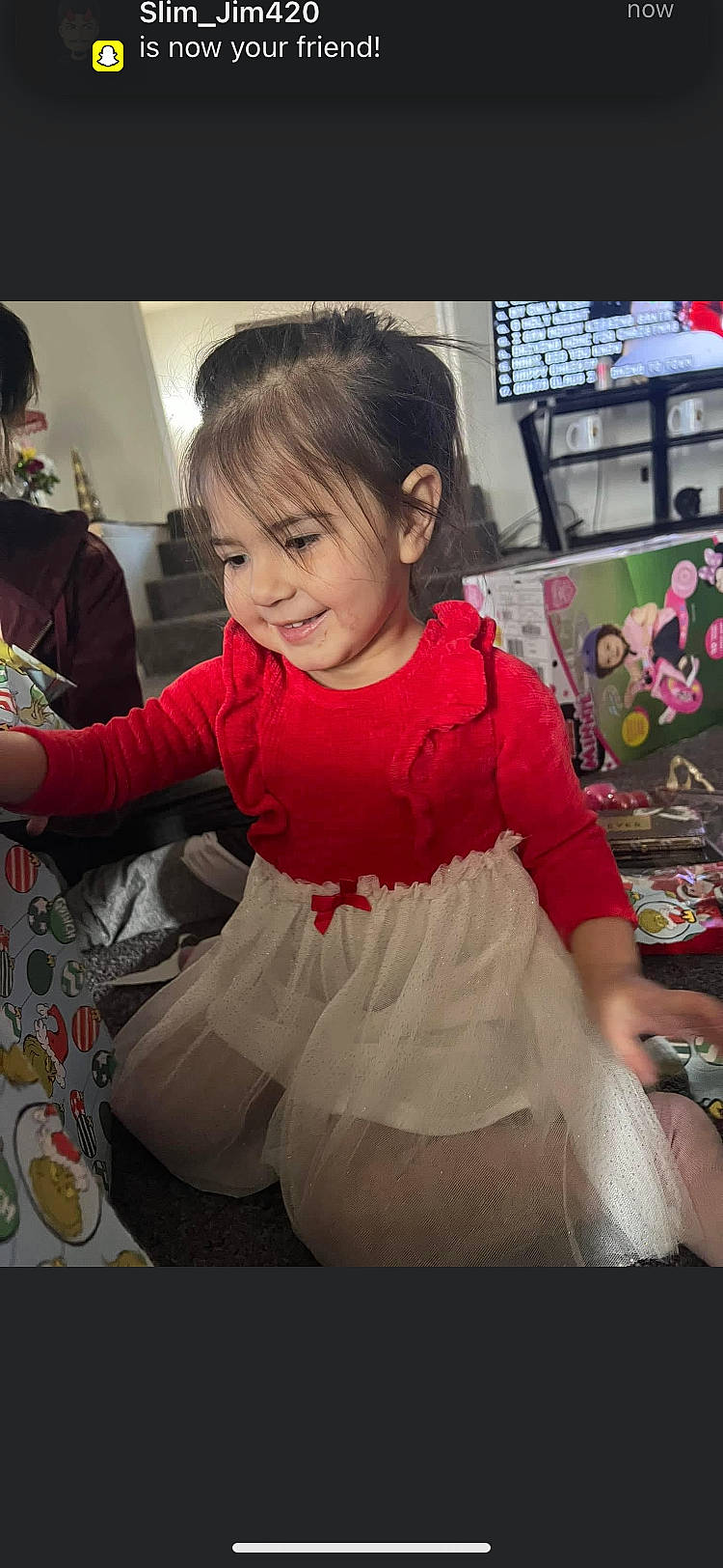 Desiree is registered to the contest to win money with this photo: baby_toddler_clothing, bangs, child, costume, dress, event, facial_expression, fashion_accessory, fashion_design, fun, hairstyle, happy, joy, magenta, pattern, person, pink, room, sitting, sleeve