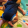 baby, infant, onesie, plush_toy, play_mat, hand, finger, person, clothing, diaper, blue, pattern, cute, young_child, skin, lying_down, indoors, colorful, soft, toddler