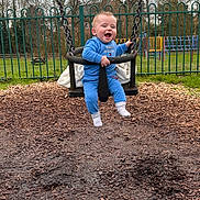Bentley is registered to the contest to win money with this photo: baby, clothing, face, footwear, grass, head, hosiery, nature, outdoorplayarea, outdoors, pants, park, person, photography, plant, playarea, portrait, shoe, sock, soil