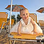 toddler, child, beach, sand, umbrella, chair, yellow, dress, sunlight, playful, outdoor, summer, happy, smiling, person, vacation, holiday, fun, sunshine, relaxation