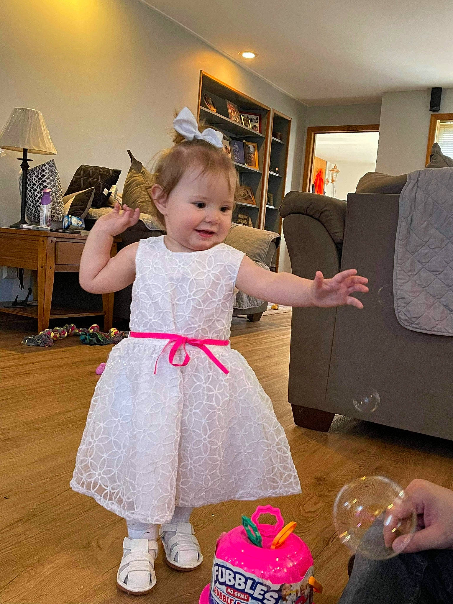 Callie is registered to the contest to win money with this photo: baby_toddler_clothing, beauty, child, drawer, floor, flooring, fun, hairstyle, happy, hardwood, home_appliance, joy, lamp, lighting, magenta, person, pink, purple, shoulder, sitting