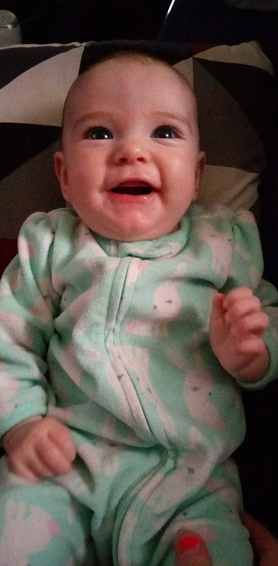 Nova is registered to the contest to win money with this photo: baby, baby_toddler_clothing, cheek, child, chin, eye, facial_expression, gesture, head, human_body, iris, lip, mouth, nose, person, pink, product, skin, sleeve, smile