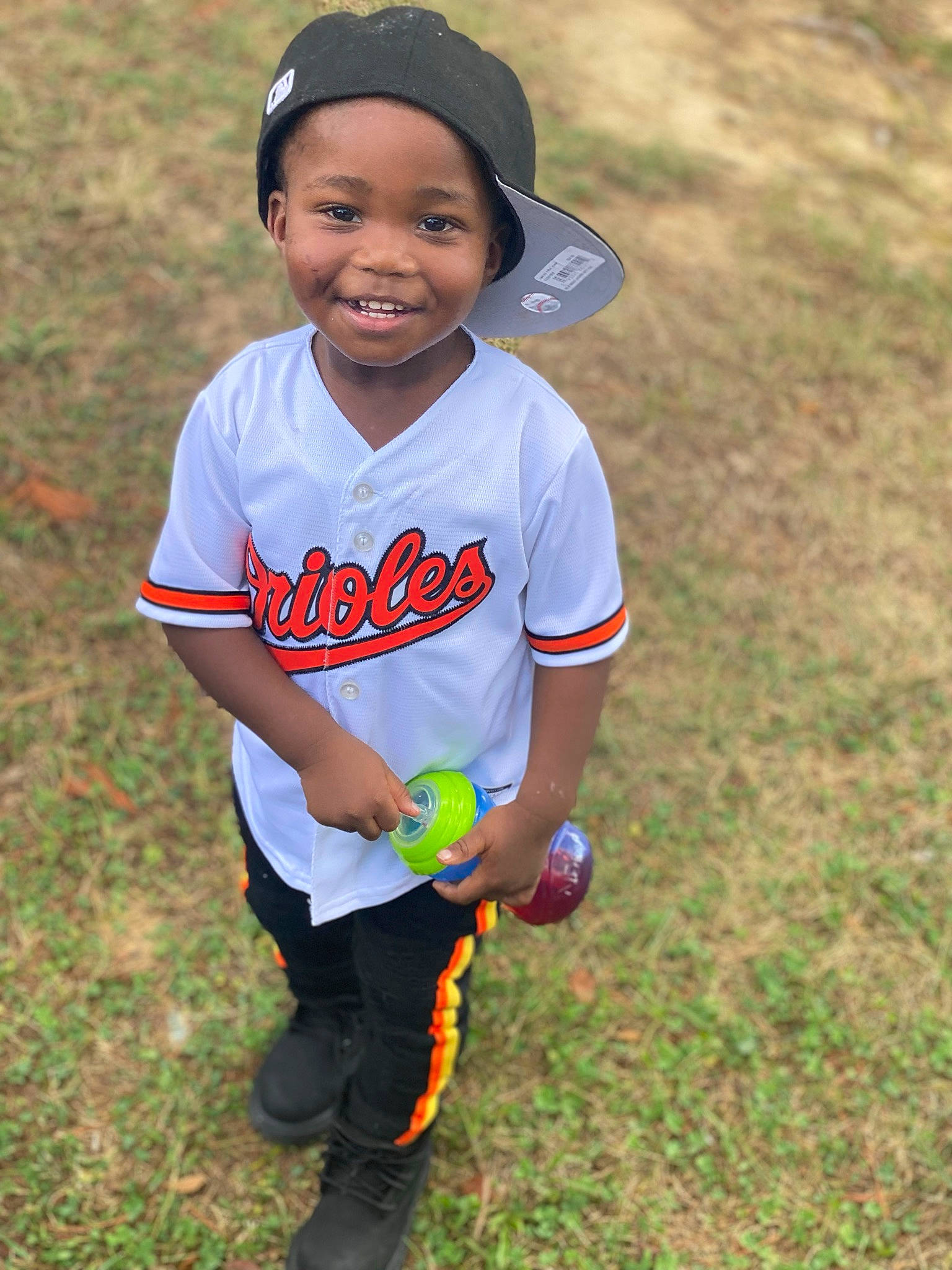 Demari is registered to the contest to win money with this photo: baseball_cap, cap, competition_event, cool, electric_blue, face, fun, grass, grassland, hair, happy, hat, headwear, joy, leisure, people_in_nature, person, player, recreation, smile