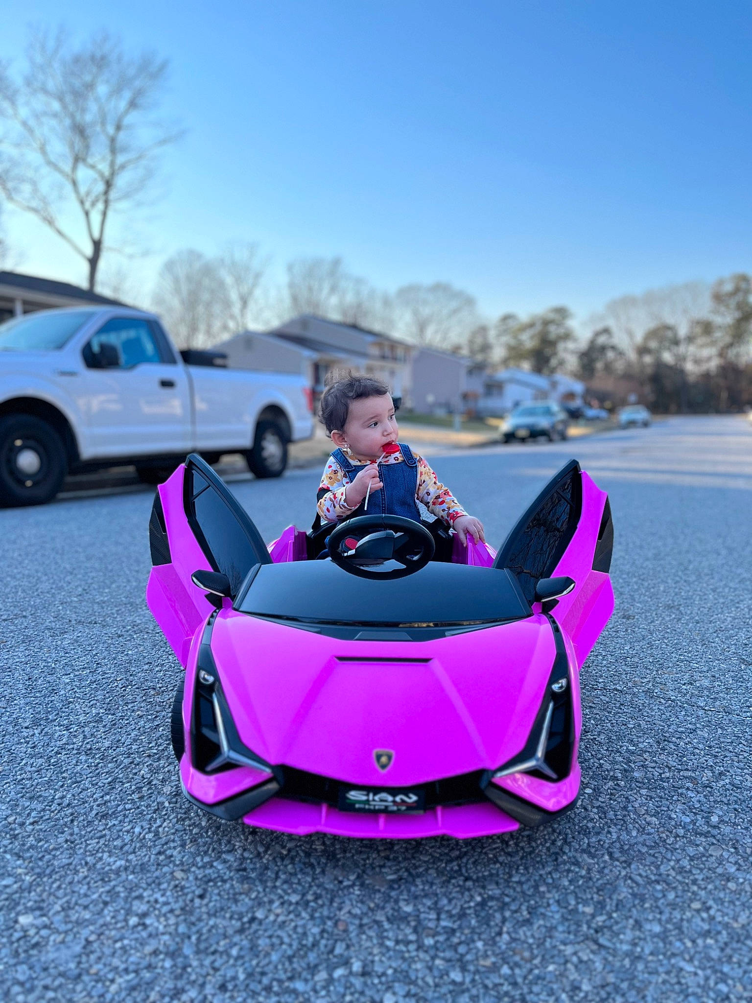 Avaleigh joined the competition — help win amazing prizes! asphalt, automotive_design, automotive_exterior, automotive_lighting, automotive_tire, bumper, car, hood, land_vehicle, mode_of_transport, motor_vehicle, person, pink, rim, sky, tints_and_shades, tire, tree, vehicle, vehicle_door
