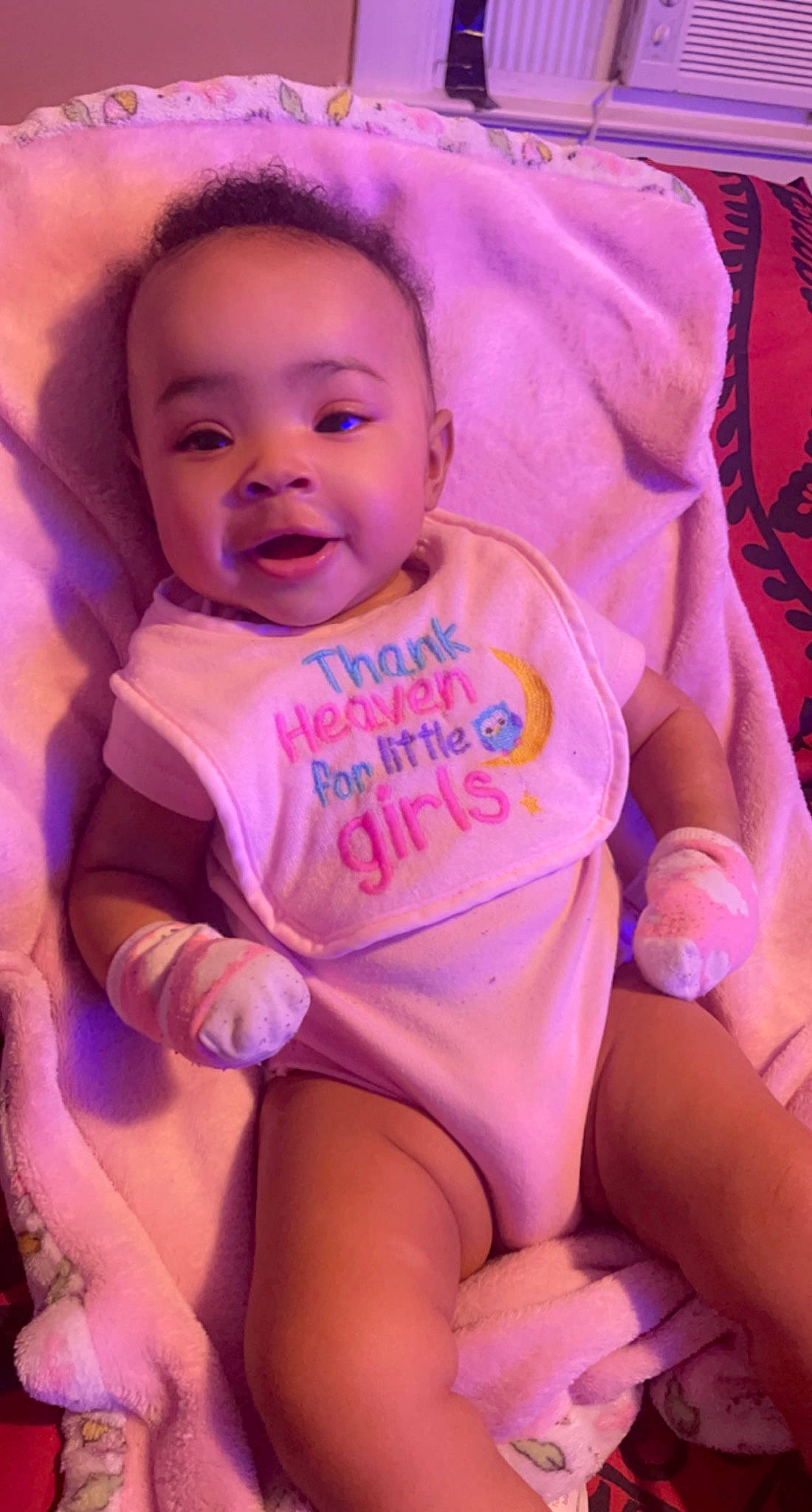 Asha is registered to the contest to win money with this photo: baby, baby_toddler_clothing, cheek, comfort, eye, face, finger, happy, head, human_body, lip, magenta, mouth, person, pink, purple, skin, smile, textile, thigh