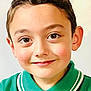 child, boy, face, smile, eyes, green_shirt, polo_shirt, portrait, close_up, young, cute, happy, casual, childhood, innocent, person, headshot, indoors, light_background, hair